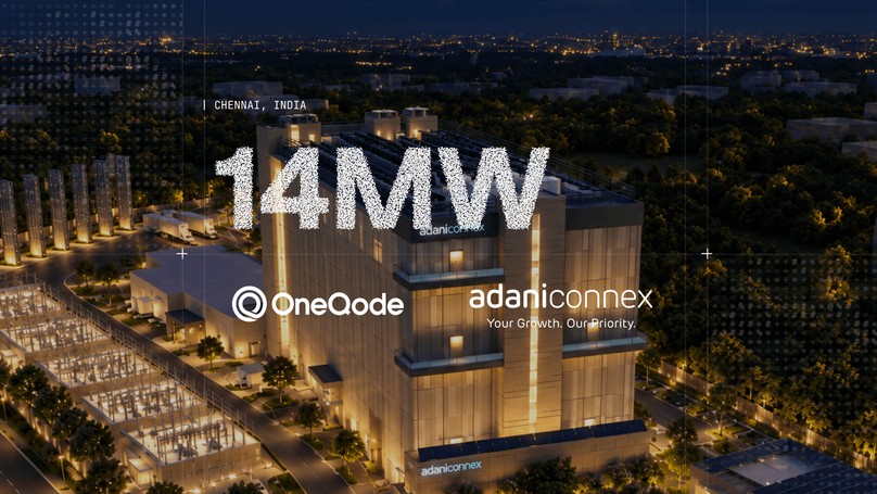 OneQode and AdaniConneX logos over a night-time aerial view of the AdaniConneX data center in Chennai, India, with the headline 14MW